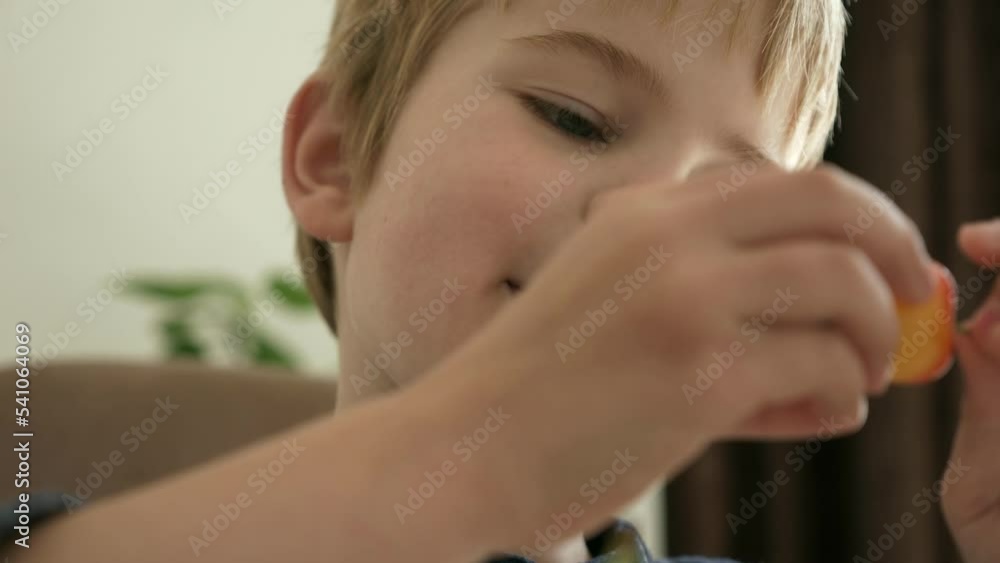 Close-up Cute Little Boy Kid Child Enjoy Eat Sweet Cherry Fruit Food Meal Kitchen Home Day Dining Room. 2x Slow motion 60 fps 4K Close-up Cute Little Boy Kid Child Enjoy Eat Sweet Cherry Fruit Food Meal Kitchen Home Day Dining Room. 2x Slow motion 60 fps 4K