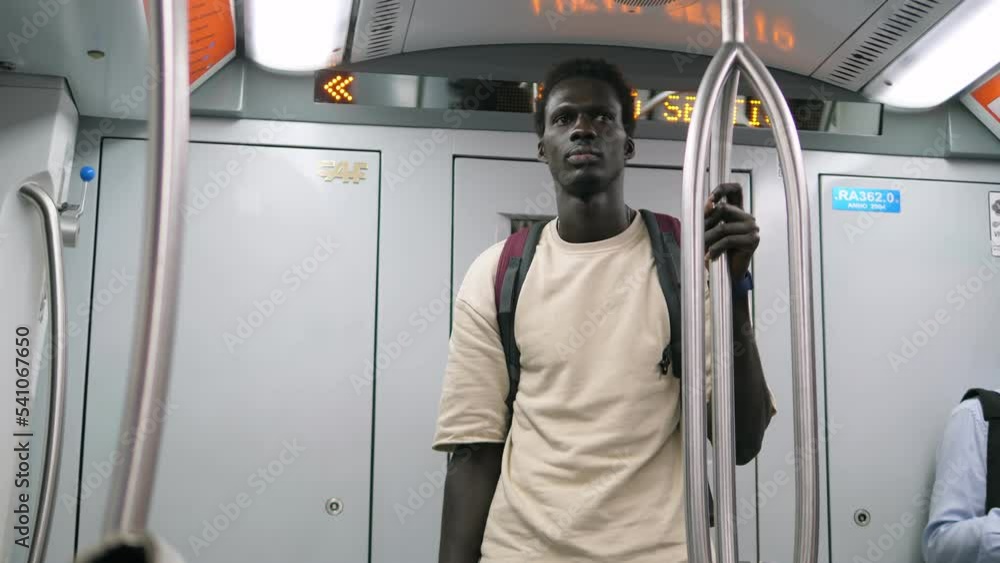 Afro American man in the subway going to work Afro American man in the subway going to work