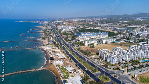 Aerial drone photo of the beautiful town of Alanya, a resort town on Turkey’s central Mediterranean coast showing a hotel and vacation holiday resort from above in the summer time.