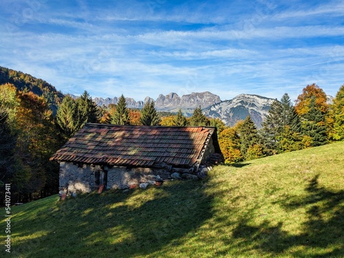 hiking in the beautiful Weisstannen valley in the canton of St. Gallen. Fall colors in the woods. Alp hut with a view of the mountains. High quality photo photo