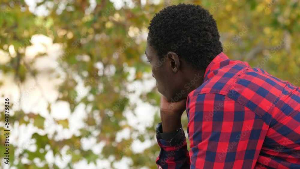 African immigrant alone in the street: loneliness, poverty, misery concept African immigrant alone in the street: loneliness, poverty, misery concept