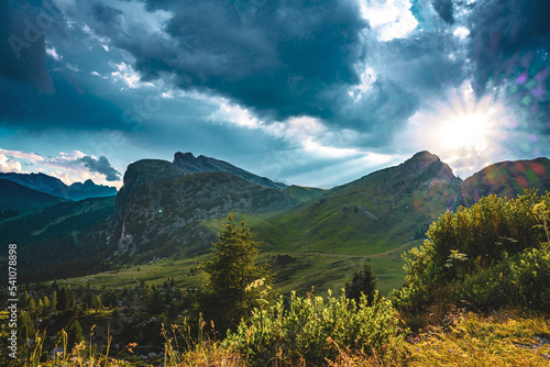 Looming thunderclouds create a beautiful evening atmosphere in the Dolomites. Falzarego pass, Dolomites, South Tirol, Italy, Europe.