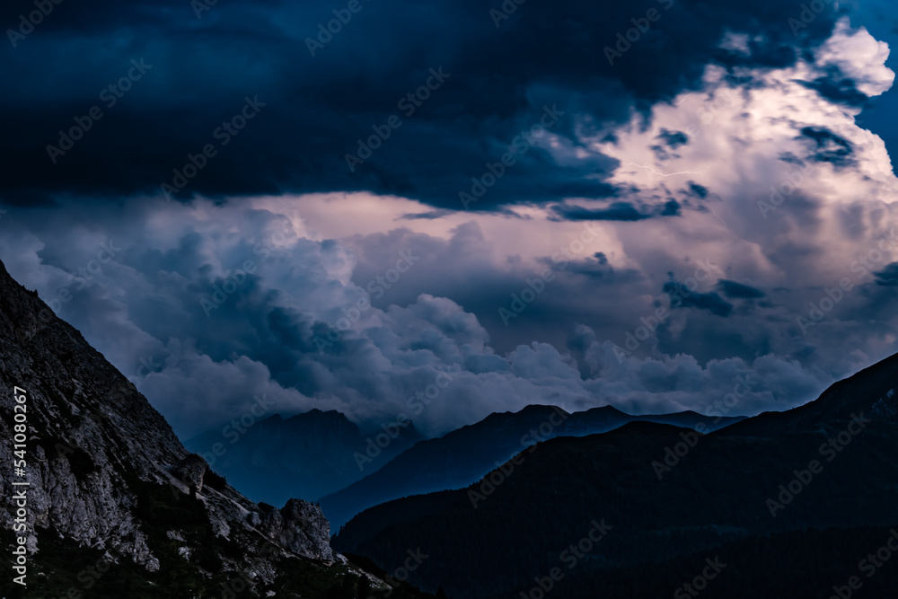 Obraz premium Late evening thunderstorm over Marmolada observed from Falzarego pass camper parking area. Falzarego pass, Dolomites, South Tirol, Italy, Europe.