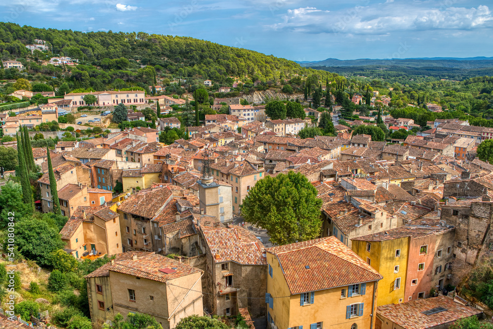 Fototapeta premium Travel destination, small old village in hear of Provence Cotignac with famous cliffs with cave dwellings and troglodytes houses, Var, Provence Alpes Cote D'Azur, France