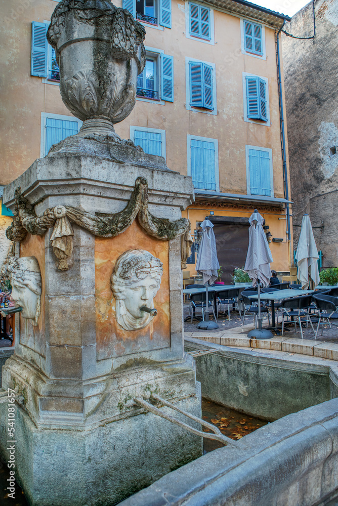 Travel destination, Fountain in Cotignac, Village of Cotignac, small old village in hear of Provence Cotignac with famous cliffs with cave dwellings and troglodytes houses, Var, Provence, France