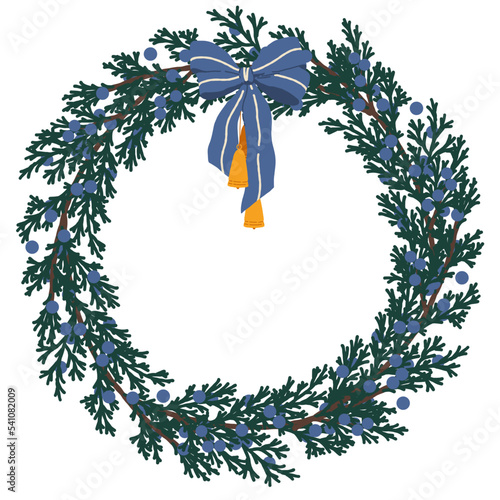 Christmas wreath with juniper, blue bow and bells.