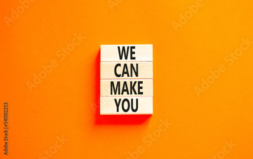 Support and we can make you symbol. Concept words We can make you on wooden blocks. Beautiful orange table orange background. Business, psychological we can make you concept. Copy space.
