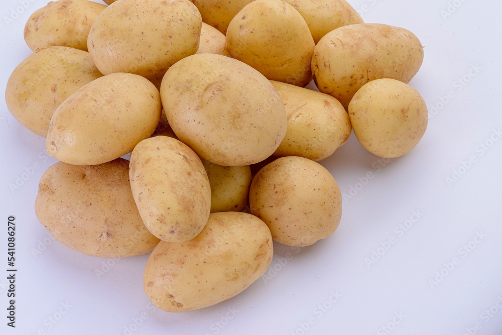 Potatoes close-up isolated on white background. Studio photo. Potatoes close-up isolated on white background. Studio photo.