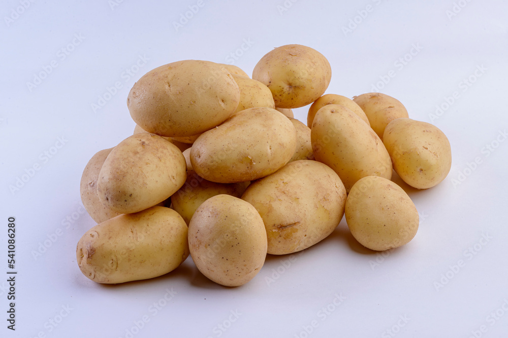 Potatoes close-up isolated on white background. Studio photo. Potatoes close-up isolated on white background. Studio photo.