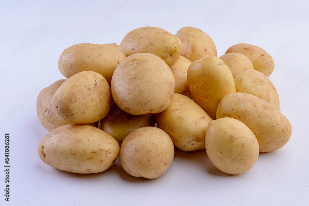 Potatoes close-up isolated on white background. Studio photo. Potatoes close-up isolated on white background. Studio photo.