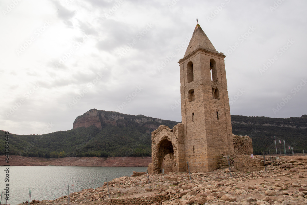 Reservoir with little water in which a church can be seen due to the drought and the little rain effect of global warming