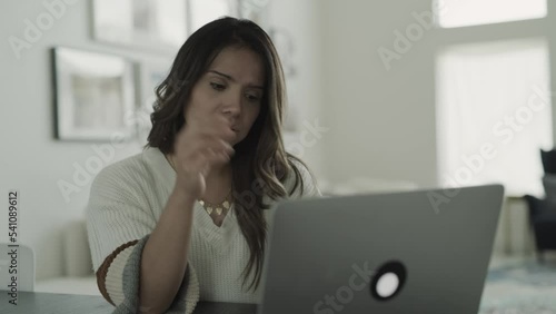 Close up of woman using laptop frustrated and confused / Lehi, Utah, United States