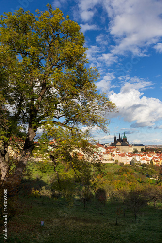 Autumn Prague City with gothic Castle, colorful Nature and Trees and dramatic Sky from the Hill Petrin, Czech Republic © Kajano