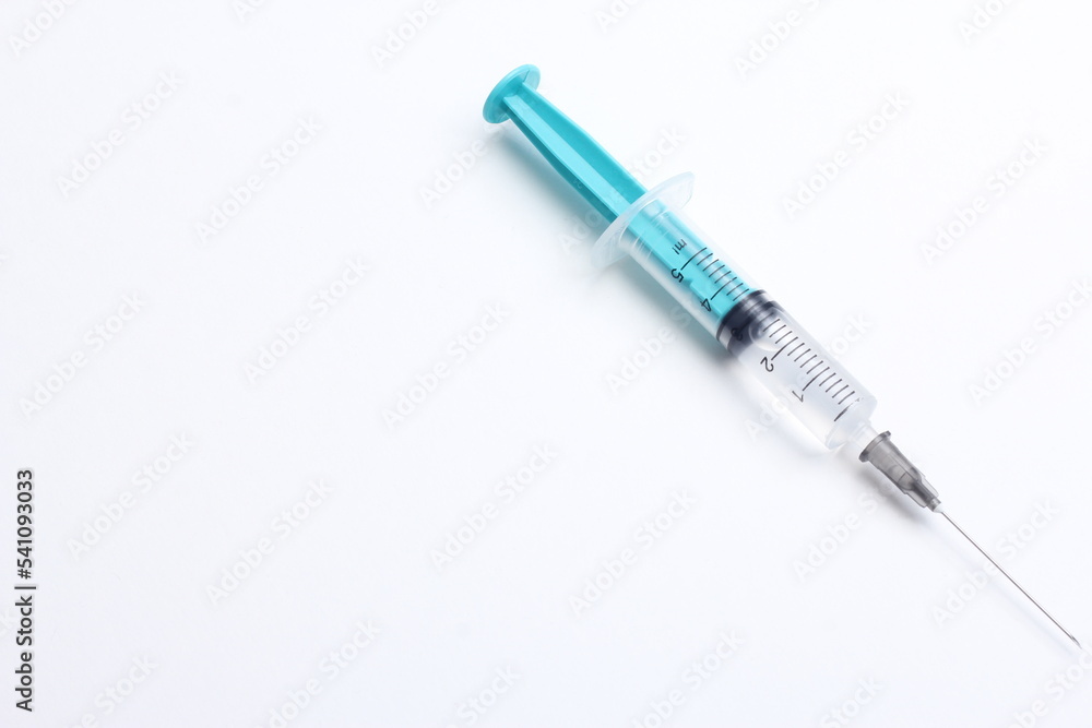 Medical syringe on a white background. A syringe for injection. The concept of health and beauty Medical syringe on a white background. A syringe for injection. The concept of health and beauty
