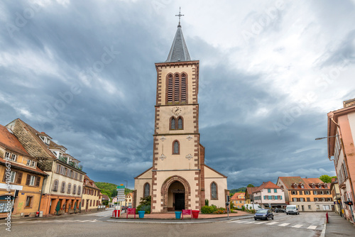 Fototapeta Naklejka Na Ścianę i Meble -  The Église Saint-Léger Catholic Church in the old town center of Munster, France, in the Alsace region.