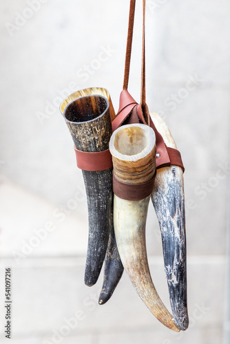 closeup of three horns traditionally used by vikings to drink mead and beer. utensils also used in ceremonies and rituals
