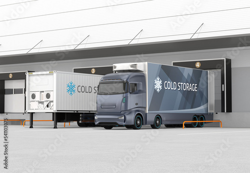 Blue electric truck with reefer container and single container trailer parking in logistics center. Cold chain concept. 3D rendering image.