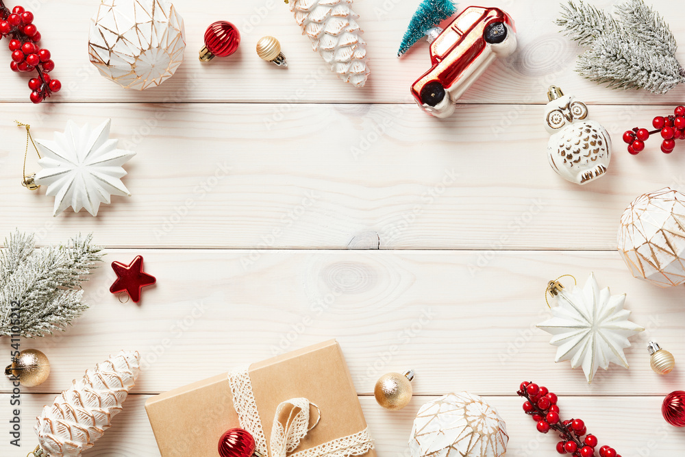Christmas white wooden desk table with aesthetic Christmas decorations and red ornaments. Vintage Christmas card template. Christmas white wooden desk table with aesthetic Christmas decorations and red ornaments. Vintage Christmas card template.