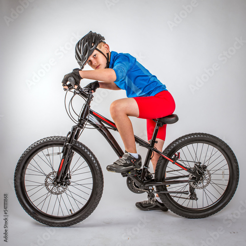 Fototapeta Naklejka Na Ścianę i Meble -  Youth Child Boy Cyclist Standing with Bike