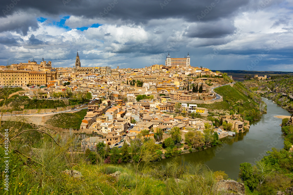 Cityscape of Toledo view of Alcazar and Tagus River. Castilla-La Mancha, Spain.