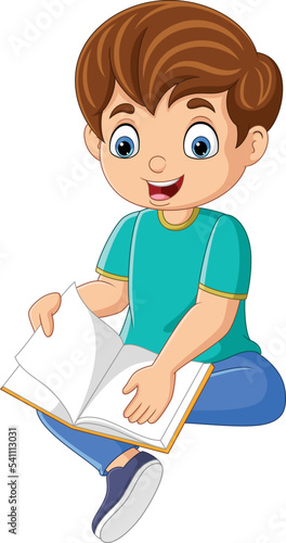 Happy little boy sitting and reading a book