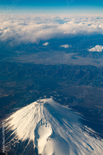 Bird Eye View shot of Fuji Mountain at Japan on Airplane with Blue Sky and Cloud