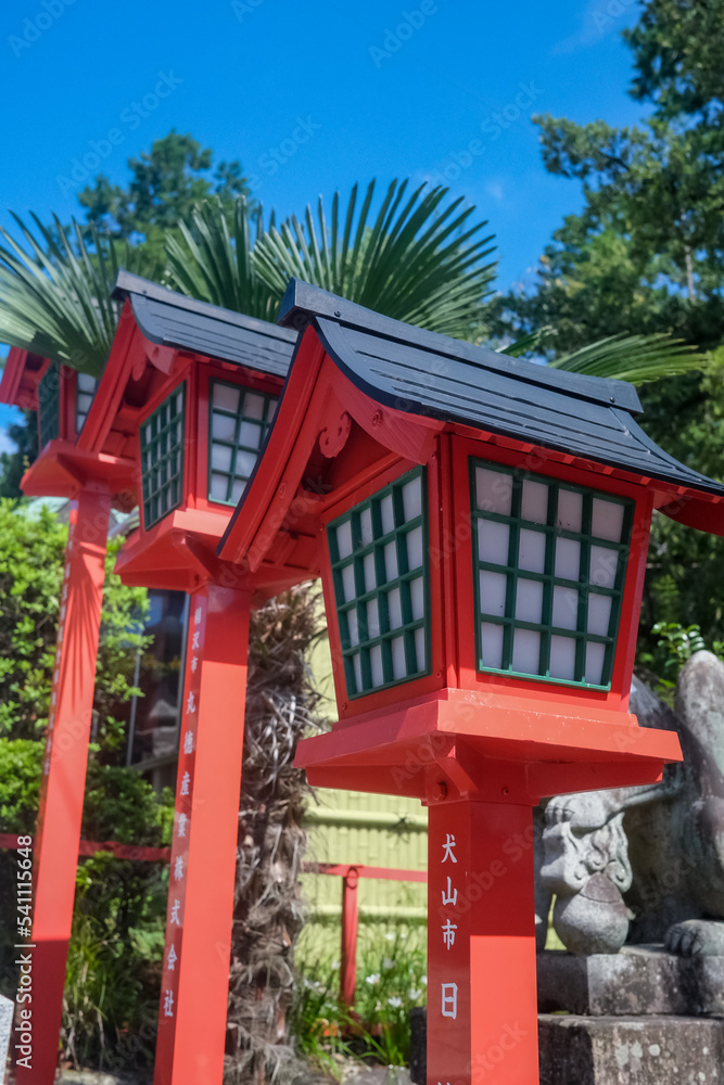 Traditional wooden Japanese lamp
at Sanko Inari Shrine at Inuyama Castle with blue sky background Traditional wooden Japanese lamp
at Sanko Inari Shrine at Inuyama Castle with blue sky background