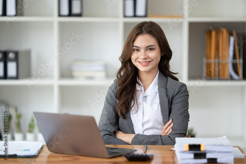 Asian woman, Happy excited successful businesswoman triumphing in office © PaeGAG