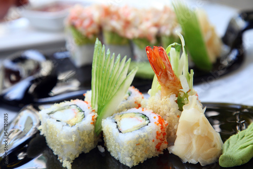 Uramaki Sushi on the sushi plate. photo