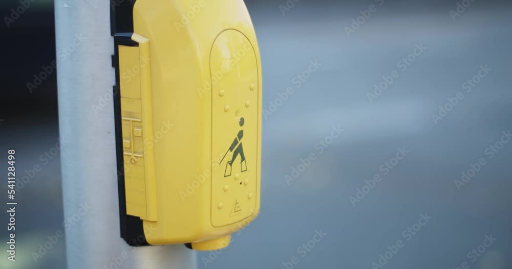 Hand pressing a button at traffic lights on pedestrian crossing switch. Automatic traffic management system.
Hand pressing a button at traffic lights on pedestrian crossing switch. Automatic traffic management system.