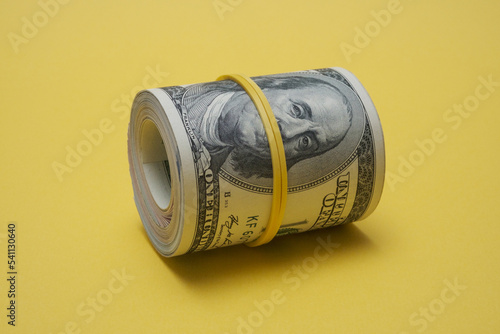 Dollars rolled up into a tube.