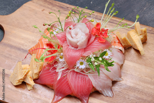 Tuna and salmon raw fish birthday cake. Flower from salmon and tuna, Japanese birthday cake