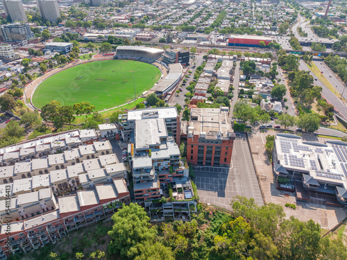 Aerial view of city buildings surrounding a sports oval photo