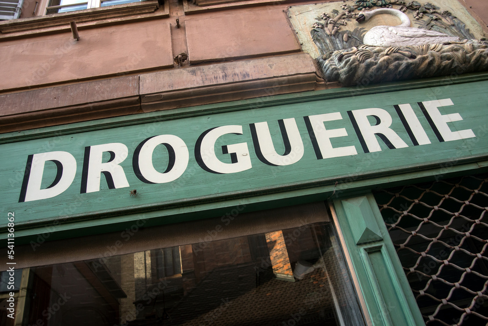 Closeup of droguerie sign on vintage store front traduction in english : drugstore