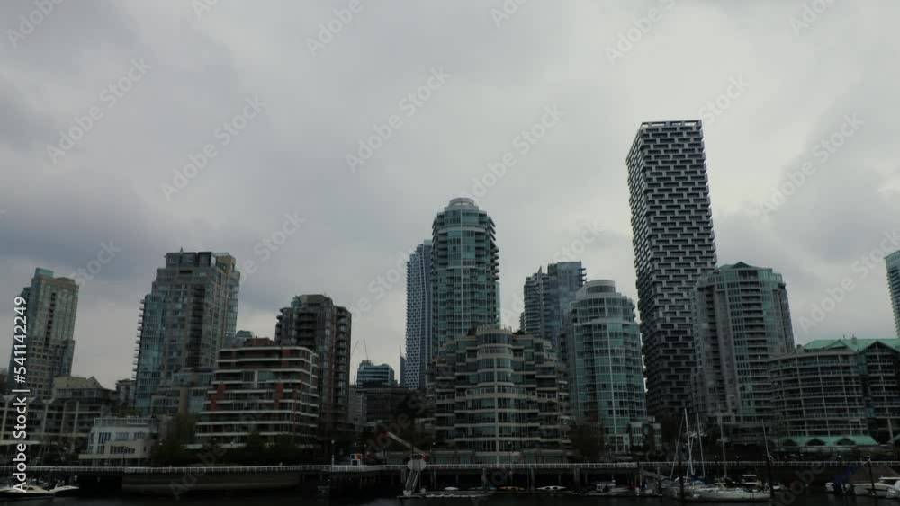 View of the Vancouver downtown from Granville island on a rainy day View of the Vancouver downtown from Granville island on a rainy day