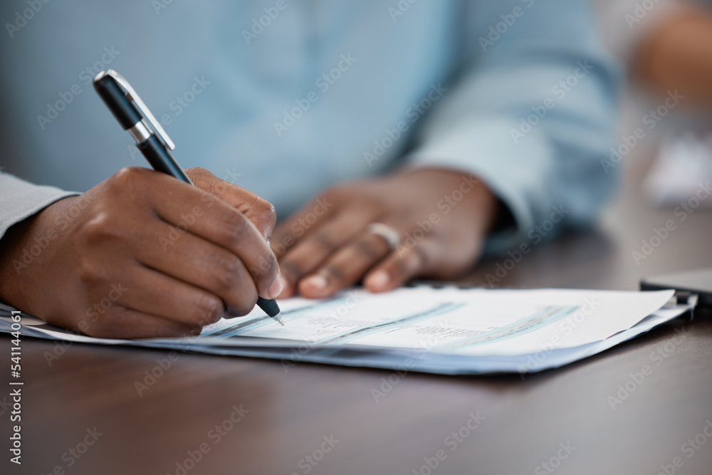 Hands, documents and contract with a black man signing paperwork at a table or desk in the office. Compliance, loan and insurance with a male putting his signature on a legal document for agreement Hands, documents and contract with a black man signing paperwork at a table or desk in the office. Compliance, loan and insurance with a male putting his signature on a legal document for agreement