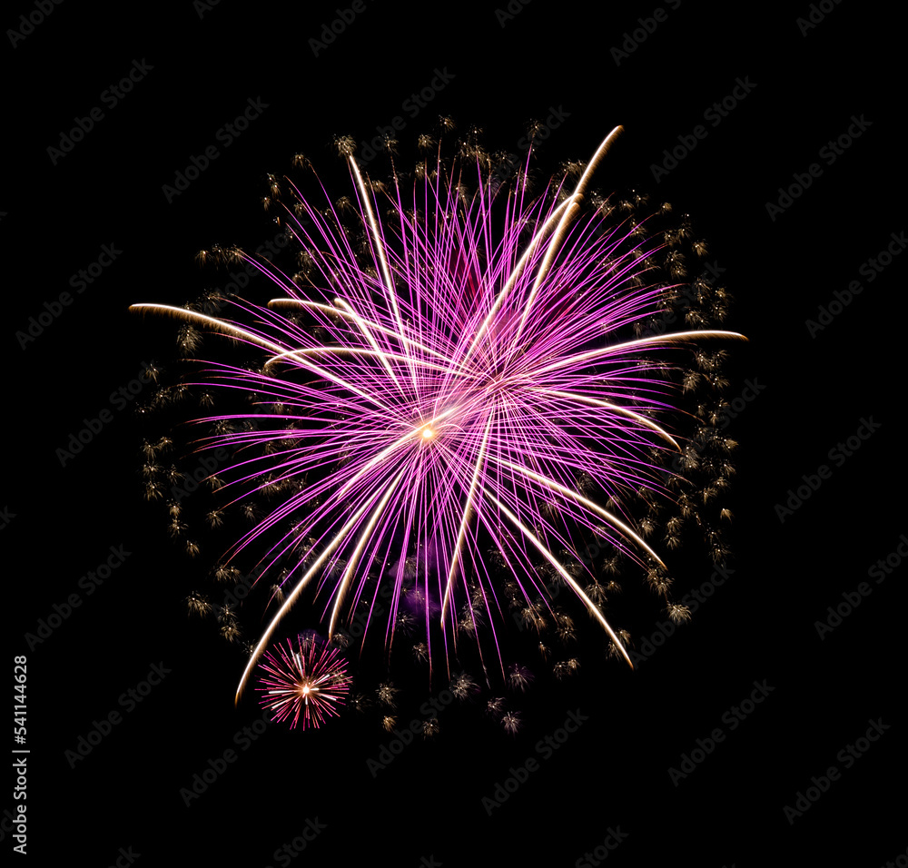Pink firework sparkling on black background for celebration and anniversary .