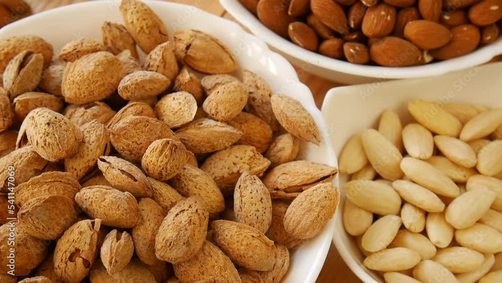 Roasted salted almonds on a plate.