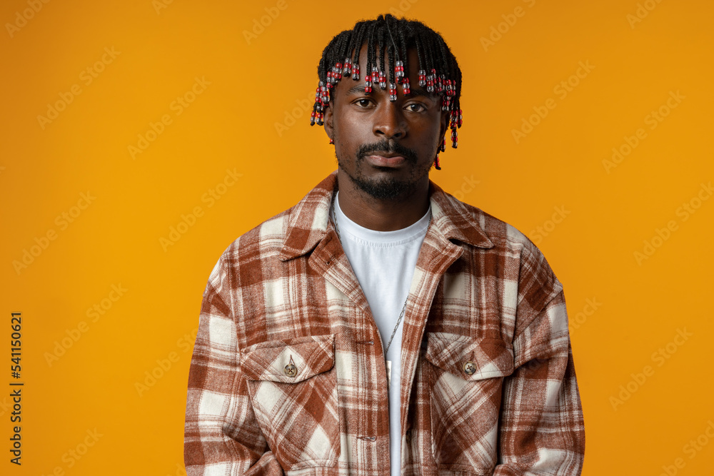 Fototapeta premium Young african man wearing casual clothes standing on yellow background