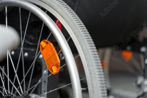 Close up view of a wheel of wheelchair