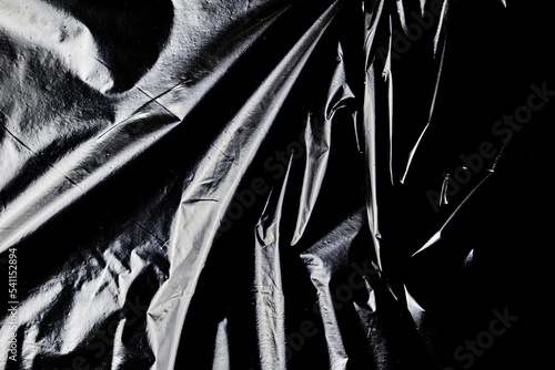 Fotografi black cellophane bag close-up background texture of plastic