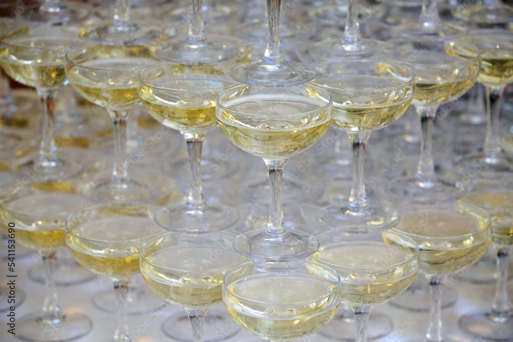 Crystal glasses for holiday, a lot of glasses for guests. Slide pyramid of glasses. Crystal glasses for holiday, a lot of glasses for guests. Slide pyramid of glasses.