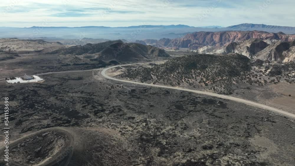 Winding Road With Mountainscape At St. George In Southwestern Utah. Aerial Wide Shot Winding Road With Mountainscape At St. George In Southwestern Utah. Aerial Wide Shot