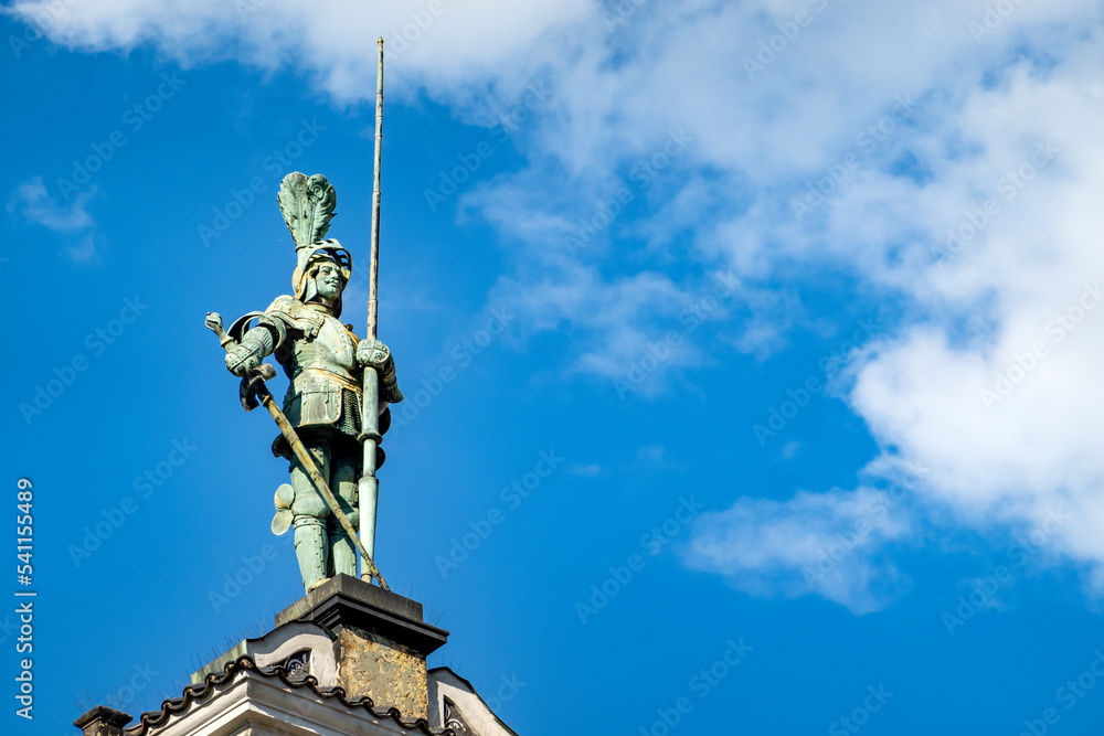 Bronze statue of a knight on the gable of the Town Hall, Charles square, Kolin , Czech republic, Europe