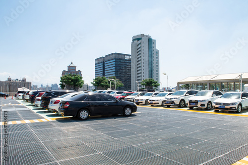  Outdoor parking lot with modern buildings and sky background. © zhikun sun
