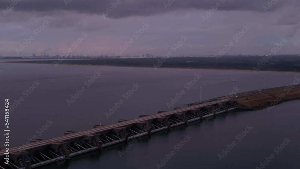 Aerial View Of Haringvlietdam Crossing The Haringvliet On Overcast Dark Grey Day Aerial View Of Haringvlietdam Crossing The Haringvliet On Overcast Dark Grey Day
