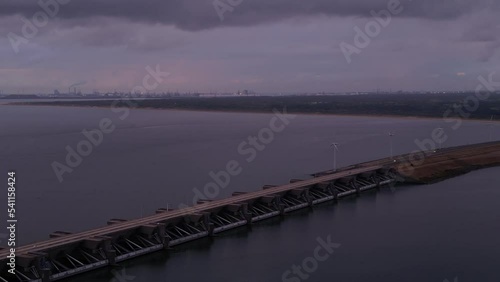 Aerial View Of Haringvlietdam Crossing The Haringvliet On Overcast Dark Grey Day photo