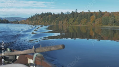 Autumn woodland colours seen from rowboat Rack Focus from oarlock photo