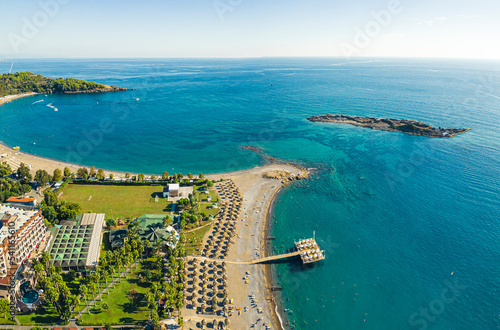 beautiful scenic drone shot of the beach, hotel and sea with bright blue water, Okurcalar, Turkey. summer vacation. High quality photo