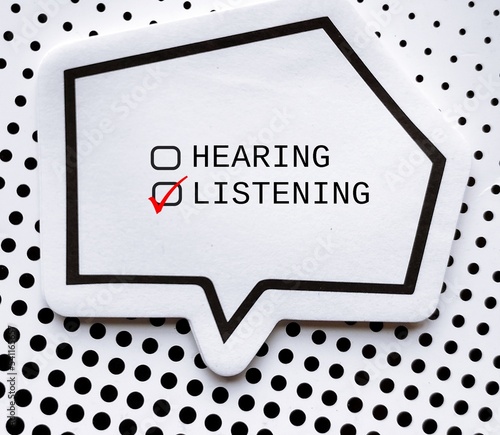 Speech note with checkbox HEARING and LISTENING, concept of choose listening than just hearing, pay more attention and understand meaning behind speakers words